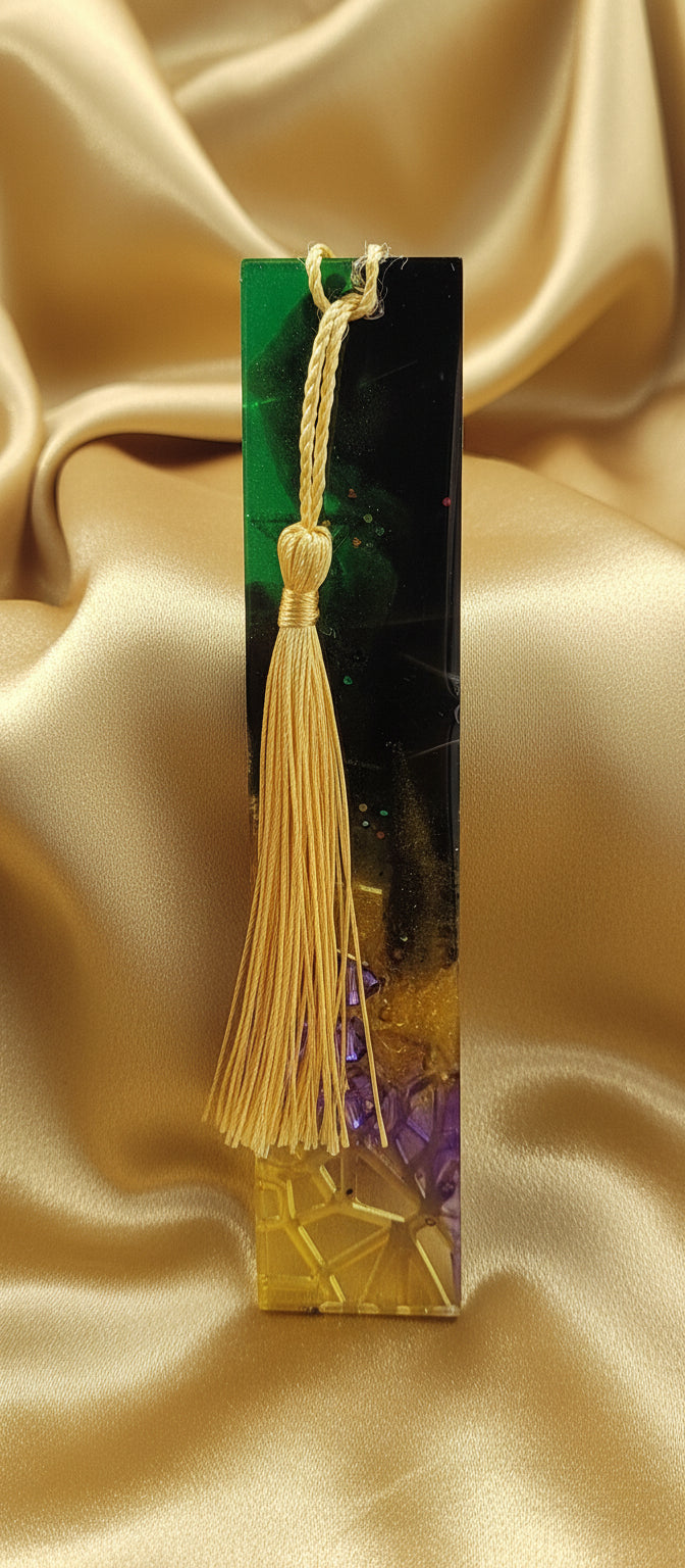 Gradient colourful bookmark displayed against a gold cloth
